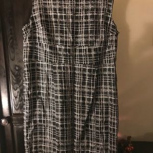 Sleeveless dress with waist detail.